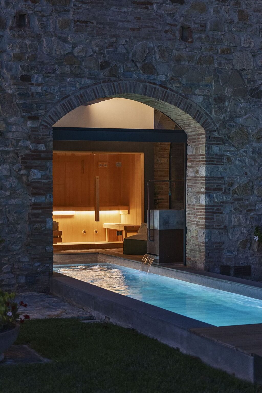 Pool beneath a stone arch at Il Cellese, Chianti
